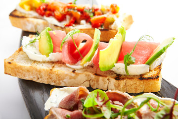Bruschetta with tuna and avocado closeup view