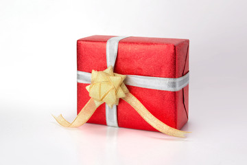 Red gift box with ribbon isolated on white background