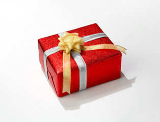 Red gift box with ribbon isolated on white background