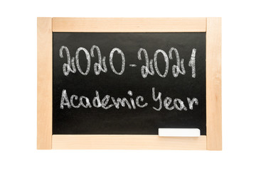 Blackboard with the text 2020 2021 academic year. School Board in wooden frame isolated on white background.