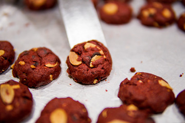 Red velvet cookies on a tray ready to pack
