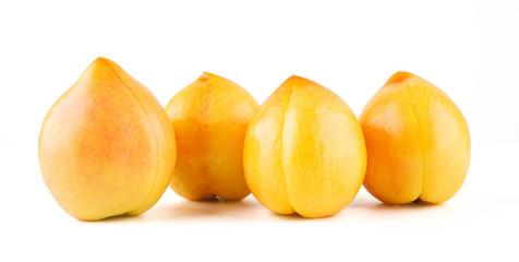 Fresh yellow peach isolated on white background.