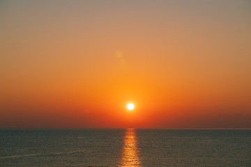 The sun rises on the sea at summer morning 