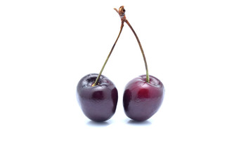 Cherry with leaves isolated on white background.