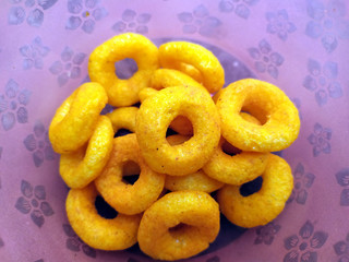 SOME YELLOW EATABLE FOOD PUT IN A BOWL 