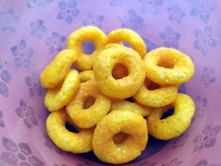 SOME YELLOW EATABLE FOOD PUT IN A BOWL 