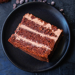 chocolate cake with cream (sweet and delicious homemade dessert, Prague cake) menu concept background. top view. copy space for text