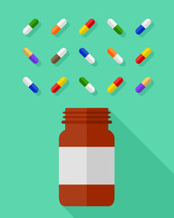 Pill bottle and an assortment of multicolor pills and capsules beautifully arranged on green background. Medicine and medication concept in flat design.