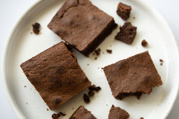 Top view of pieces of chocolate pie on white plate
