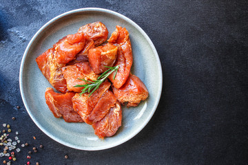 raw meat pork or beef in a plate on the table (preparing healthy food, marinade and spices paprika) menu concept background. top view. copy space for text