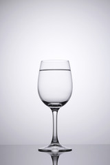 Wine glass with pure water clean isolated on white with space on top for copy