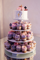  white holiday cake with pancakes and decorative accents