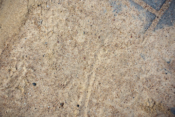 Dirty sand on the paving stones