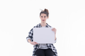 Concerned looking woman holding a blank billboard