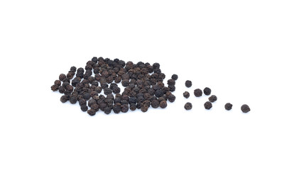 Close-up image of black pepper on white background, view above