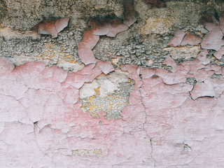 Background with peeling paint in red colors
