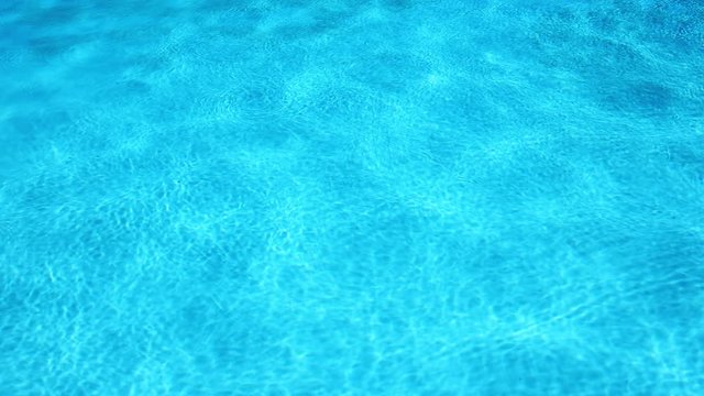 Blue water in swimming pool, tropical resort vacation, water surface background, 4k