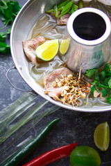 Vietnamese pho bo soup, Asian cuisine, Photo on a dark background