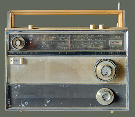 Fototapeta na wymiar Old portable radio on isolated olive green background with clipping path.