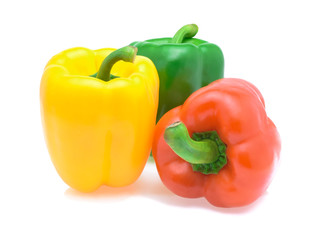 Green, red and yellow peppers, isolated on white background.