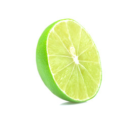 Half piece of green lime isolated on white background.