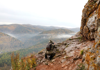 man photographing mountains