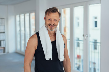 Fit athletic man after a workout in a gym