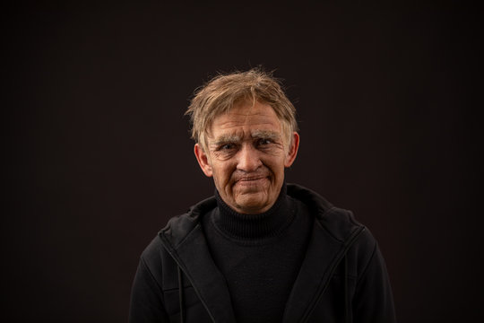 plastic makeup. makeup for cinema. old man on a black background