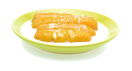 Thai banana dessert in plate on the white background.