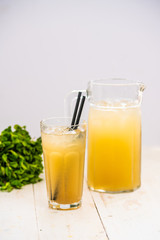 orange juice with ice. juice in a decanter
