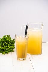orange juice with ice. juice in a decanter