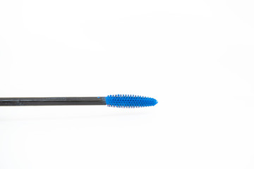 open mascara brush  with bright blue color  on a white background