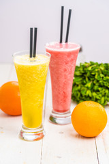 smoothie orange and strawberry. drinks in a glass. healthy diet