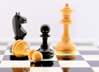 Chess playing on black white chessboard closed up