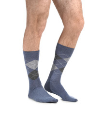 Male legs in socks on white background