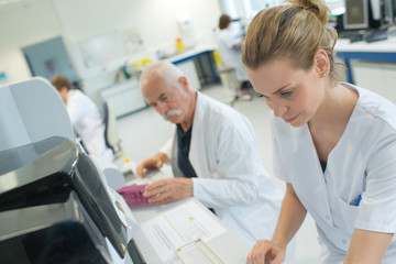 woman and senior inside the medical laboratory