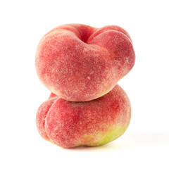 Fresh flat peach isolated on white background.