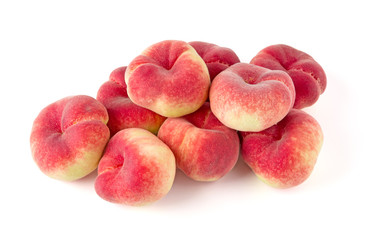 Fresh flat peach isolated on white background.