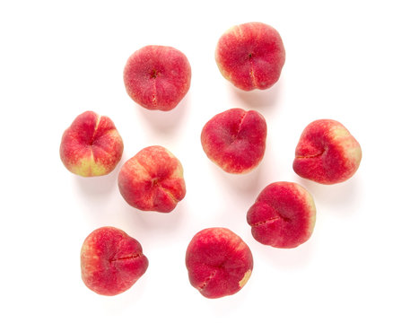 Fresh flat peach isolated on white background.