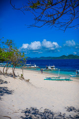 Boats and trees. Black (Malajon) island, Coron, Philippines.