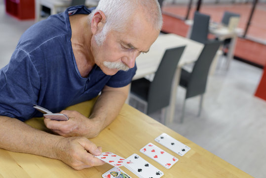 senior playing card in a retirement home
