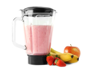 Blender with ingredients for healthy smoothie on white background