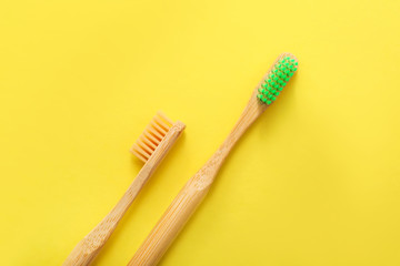 Tooth brushes on color background