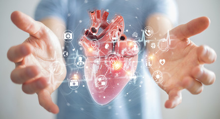 Man using digital x-ray of human heart holographic scan projection 3D rendering - Powered by Adobe