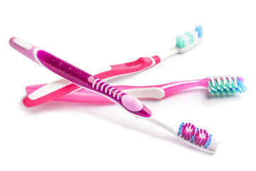 Tooth brushes on white background