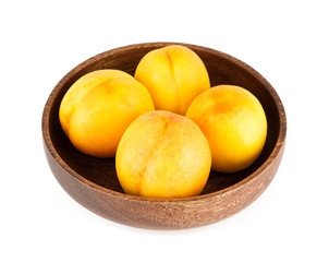 Fresh yellow peach isolated on white background.