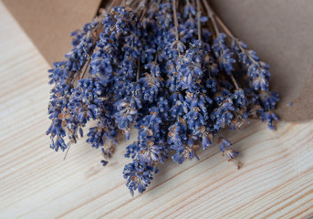 Bright lavander on wooden background with letter