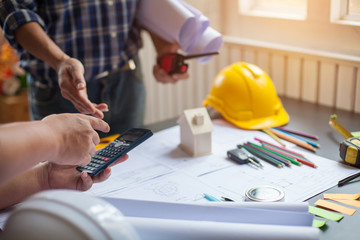 Concept Architect and desk of Architectural project in construction site or office building with mining light