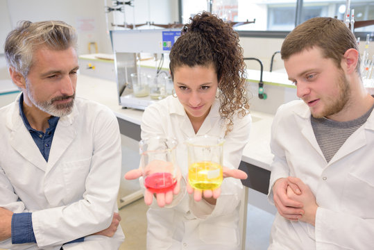 two young researchers carrying out experiments in a lab