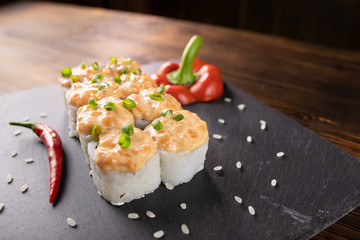 rolls with red pepper and leek on a stone board